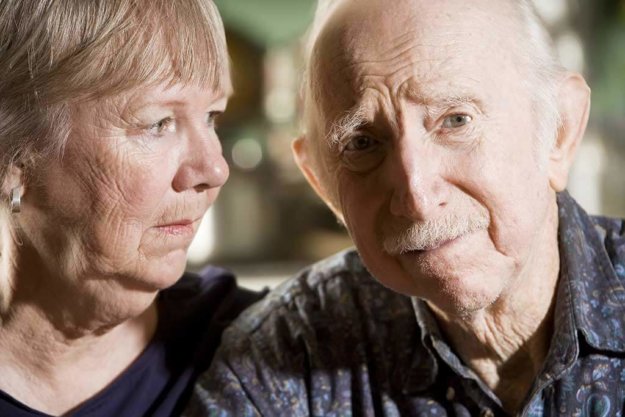 close up portrait of worried senior couple close up portrait of worried senior couple
