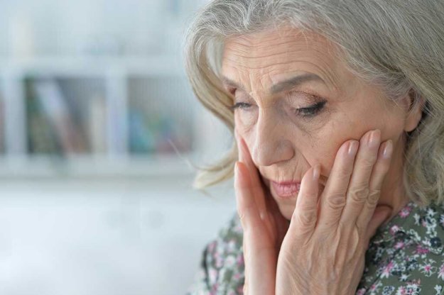 beautiful sad elderly woman