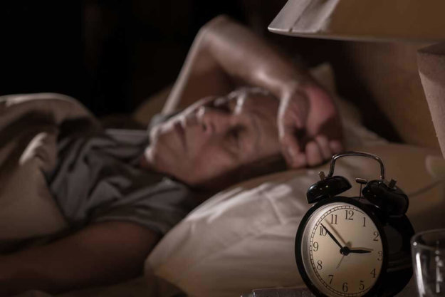 depressed senior man lying in bed cannot sleep from insomnia depressed senior man lying in bed cannot sleep from insomnia