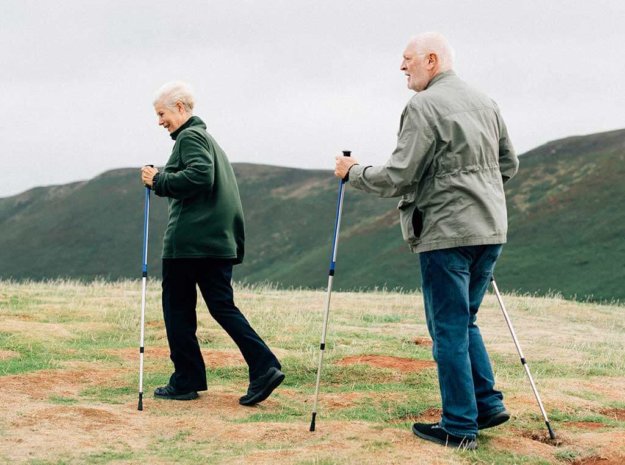 happy seniors with trekking poles