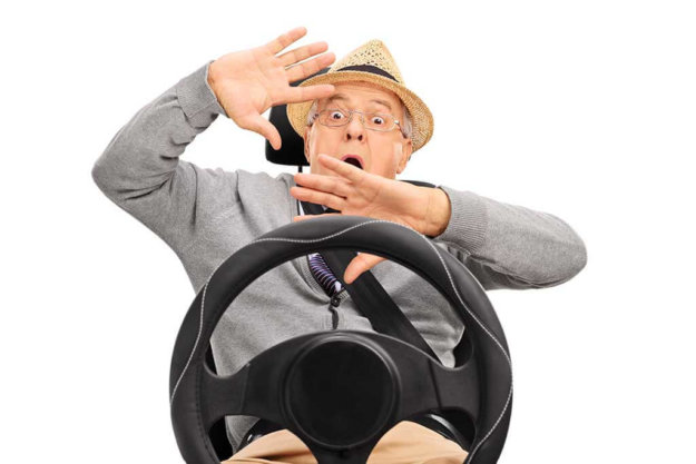 scared senior sitting on a car seat and gesturing scared senior sitting on a car seat and gesturing