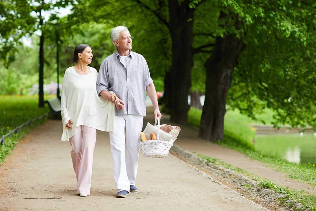 senior man with basket of snack