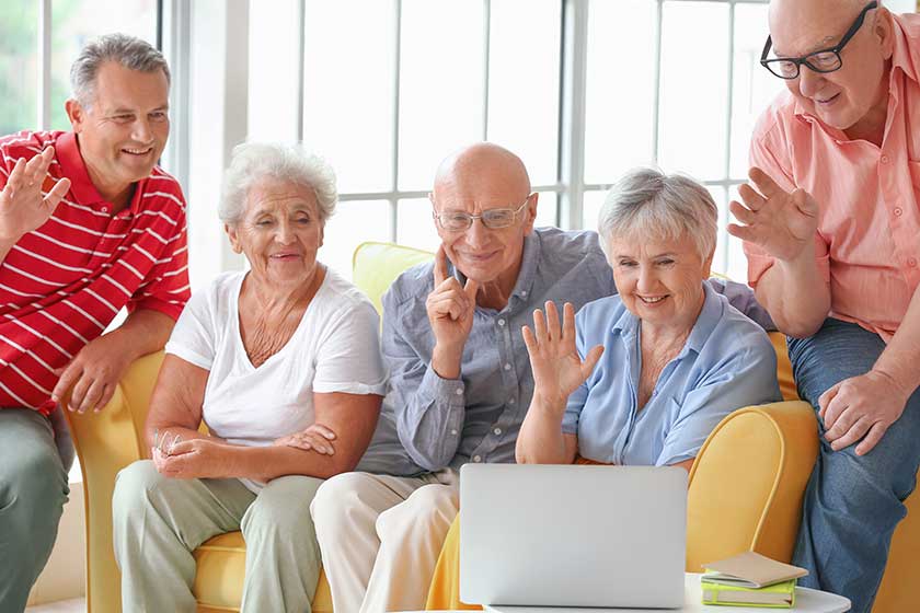 group of senior people video chatting at home