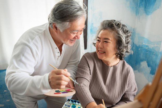 happy smiling asian elderly couple oil painting on canvas at house