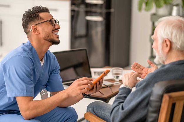 volunteer enjoying his communication with an aged person