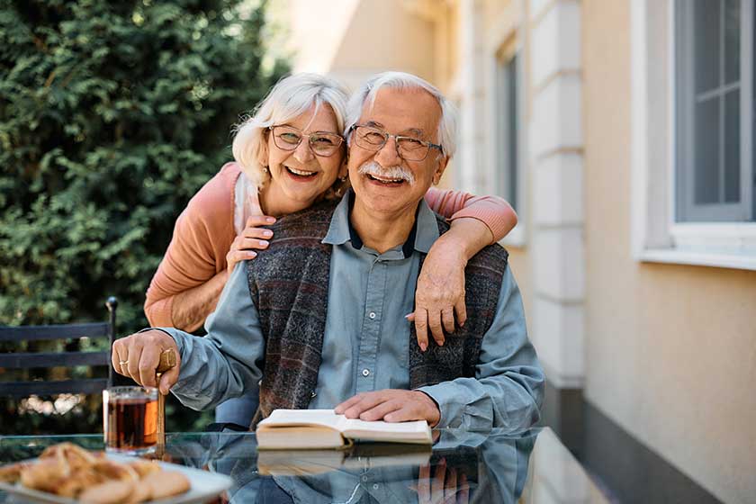 happy senior couple at independent living community looking at camera happy senior couple at independent living community looking at camera