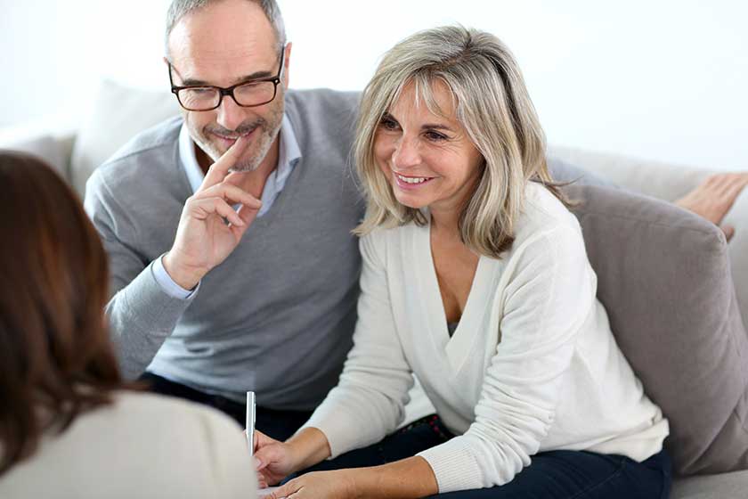 senior couple meeting financial adviser for investment