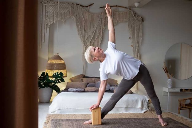 senior woman practicing yoga