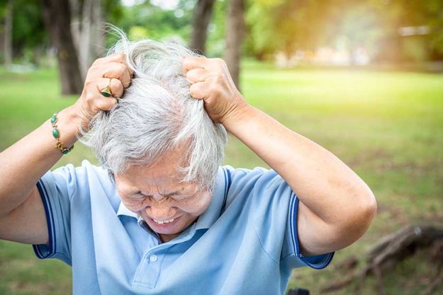 sick asian senior woman suffering from headache sick asian senior woman suffering from headache