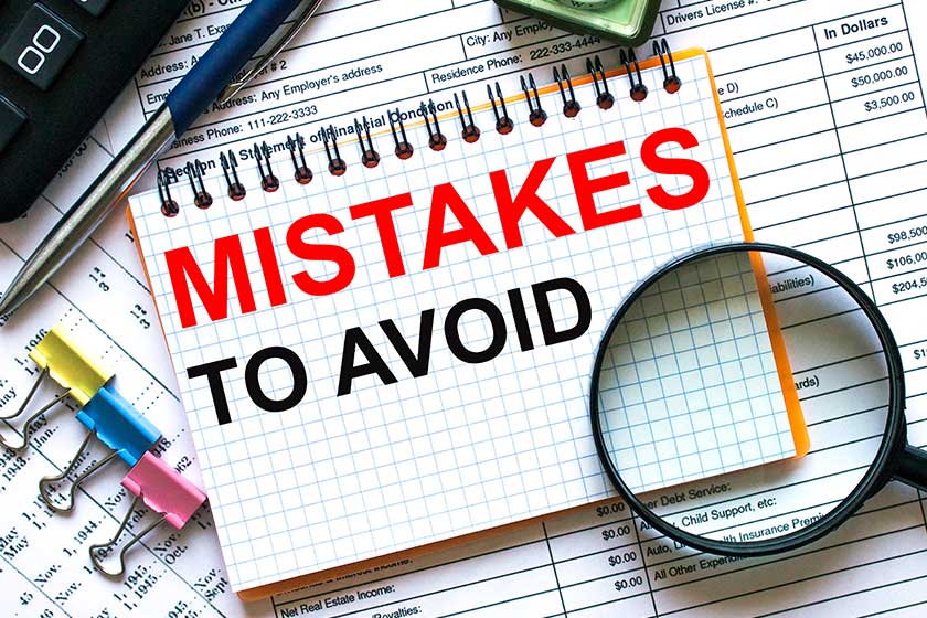 text mistakes to avoid on notepad with calculator clips pen on financial report