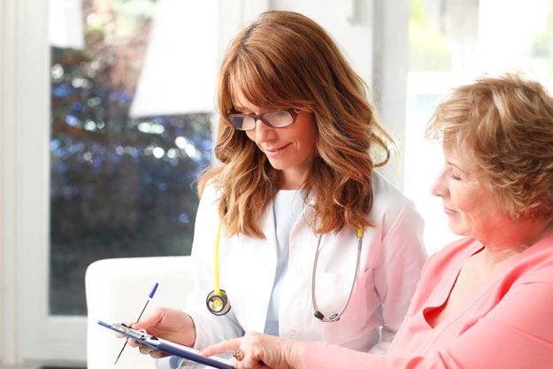 female doctor with senior patient