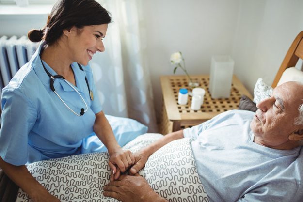 friendly doctor visiting her senior patient