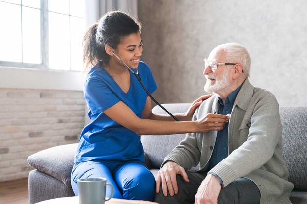 female attending physician holding stethoscope listening old patient female attending physician holding stethoscope listening old patient