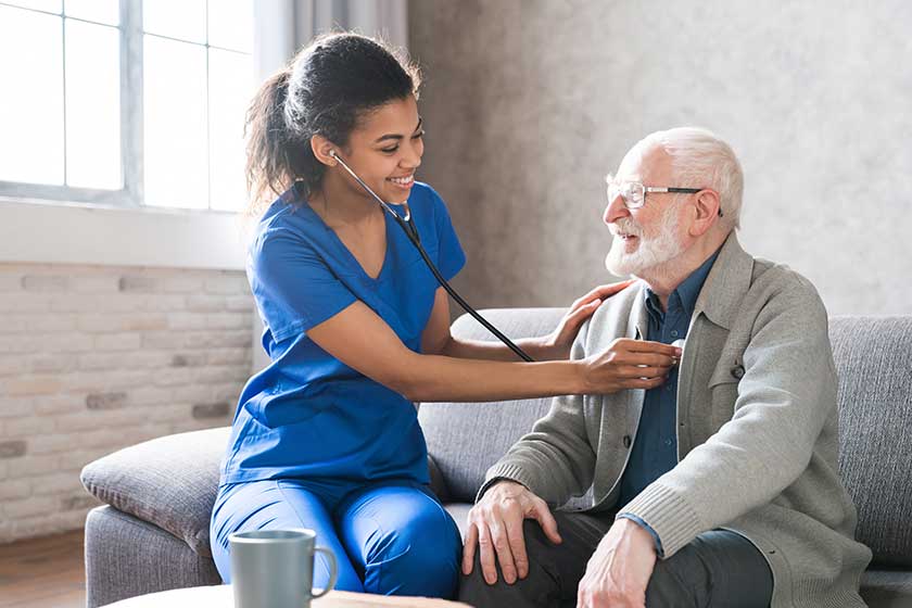 female attending physician holding stethoscope listening old patient female attending physician holding stethoscope listening old patient