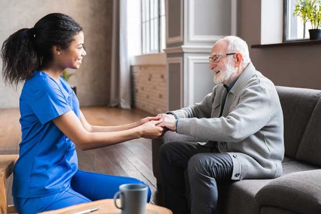 friendly cheerful african female general practitioner communicating with pleasant