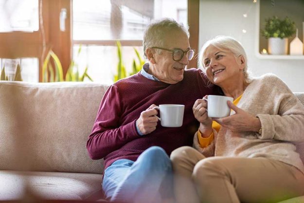 happy senior couple relaxing together at home happy senior couple relaxing together at home
