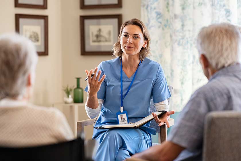 psychologist having session with seniors at care facility centre psychologist having session with seniors at care facility centre
