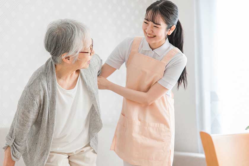 visiting caregiver women and elderly people smiles