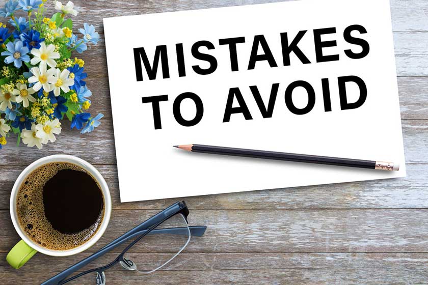 MISTAKES TO AVOIDText on notebook in office desk