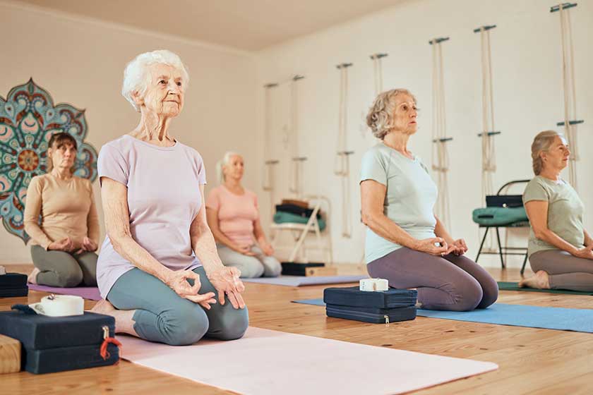 Yoga lotus and group of senior women