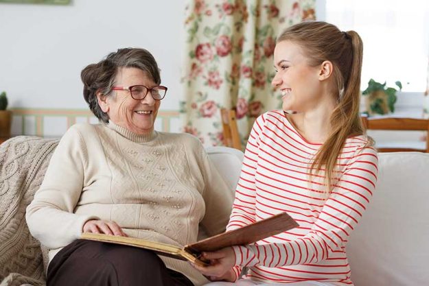 grandma laughing with her granddaughter