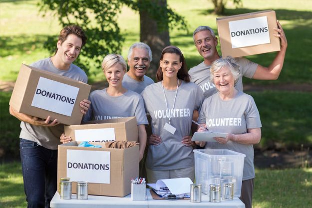 happy family holding donations boxes