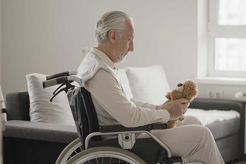 lonely old man in wheelchair holding teddy bear missing family lonely old man in wheelchair holding teddy bear missing family