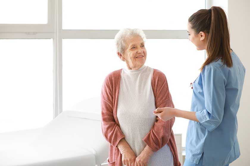 medical worker with senior woman in nursing home medical worker with senior woman in nursing home