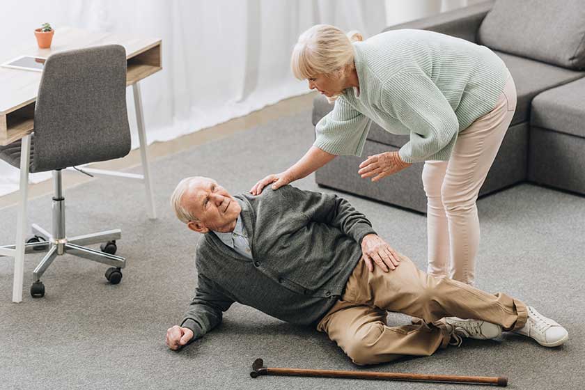 old woman looking at husband who falled down on floor