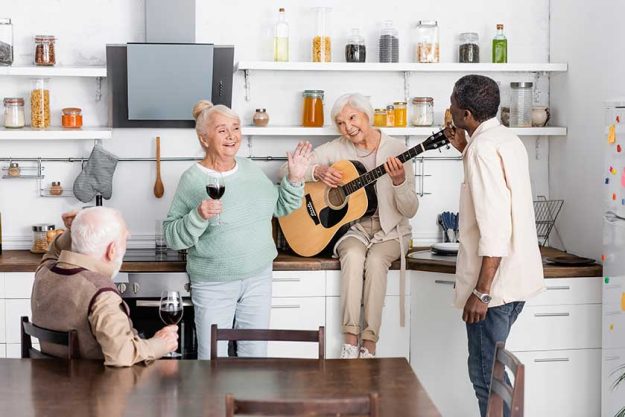 senior woman playing acoustic guitar senior woman playing acoustic guitar