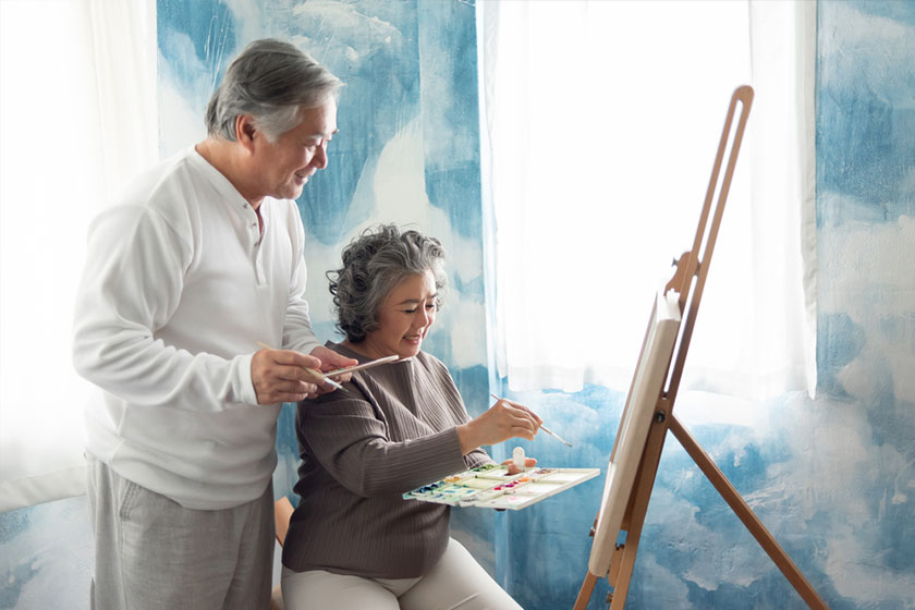 shot of a senior couple painting at home shot of a senior couple painting at home