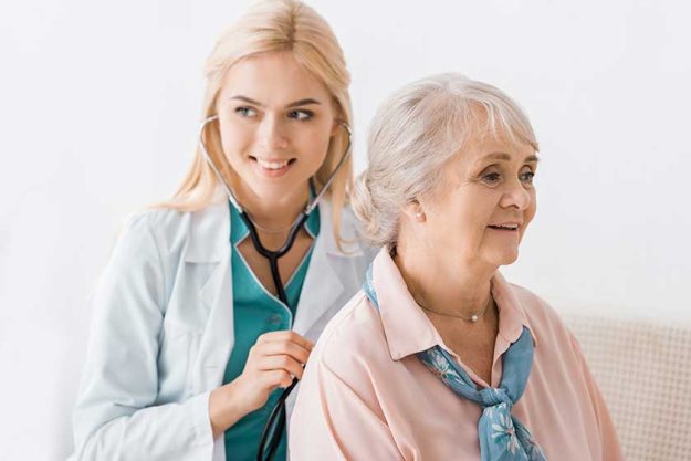 young smiling female doctor examining