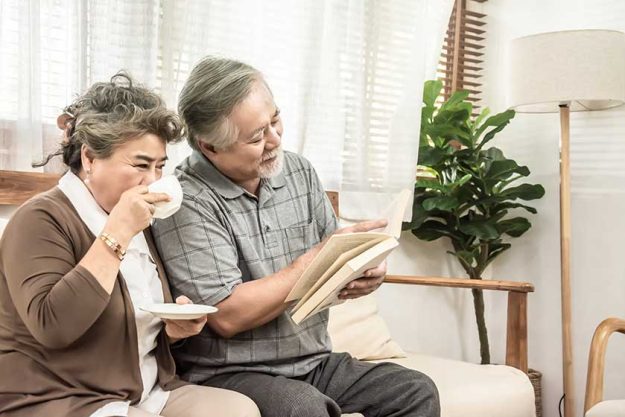 asian elderly couple sitting together asian elderly couple sitting together