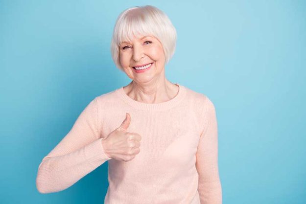 cheerful lady looking with toothy smile showin cheerful lady looking with toothy smile showin