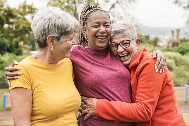 happy multiracial senior women having fun together