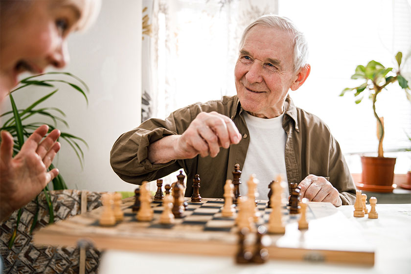 portrait of senior couple playing chess