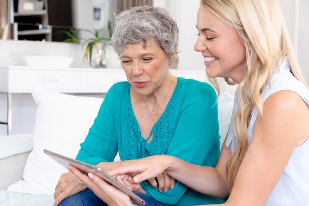 senior caucasian woman wearing green shirt her adult daughter senior caucasian woman wearing green shirt her adult daughter
