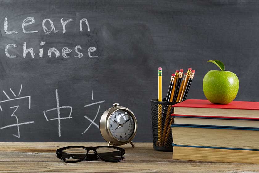 student desktop prepared to learn Chinese language