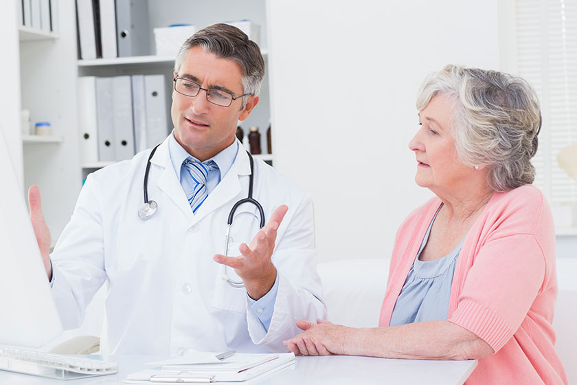 doctor explaning reports to patient doctor explaning reports to patient