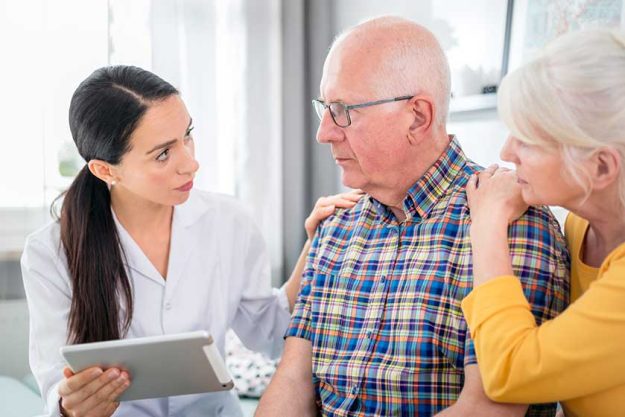 elderly couple consulting with doctor elderly couple consulting with doctor