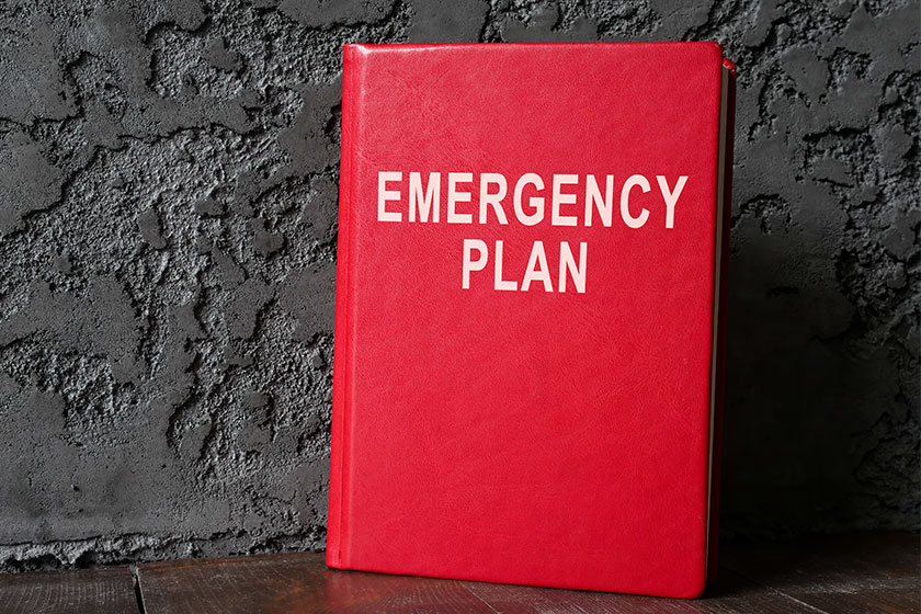 emergency plan red book near dark wall