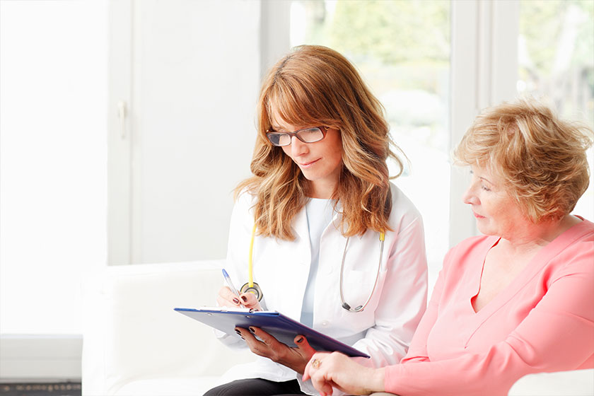 female doctor with senior patient female doctor with senior patient