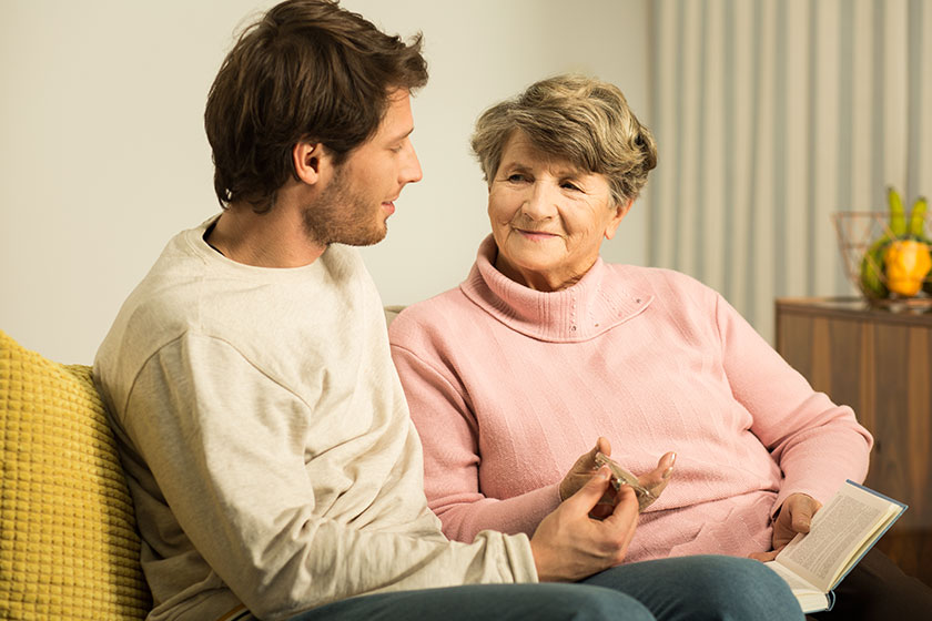 grandson supporting his grandmother