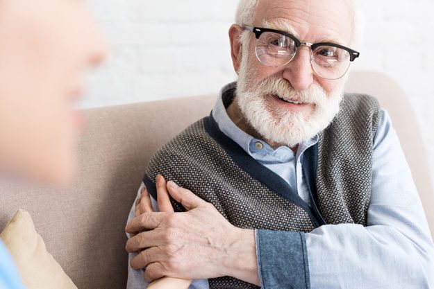 selective focus glad elderly man