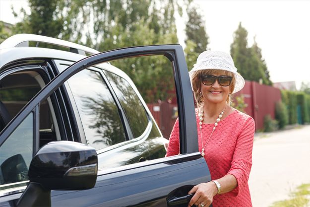 attractive mature woman in a car attractive mature woman in a car