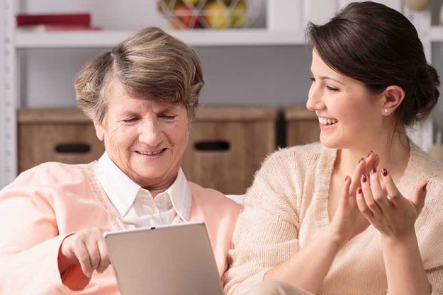 elderly woman and female caregiver