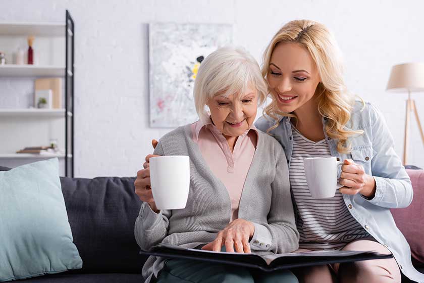 smiling elderly woman cup