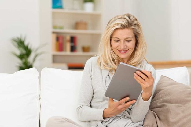 woman holding tablet