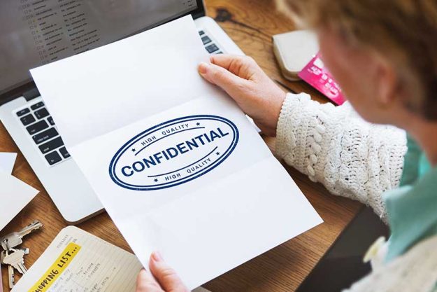 Senior woman with piece of paper