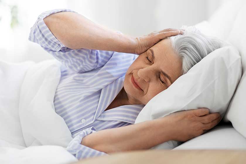 annoyed senior woman with headache